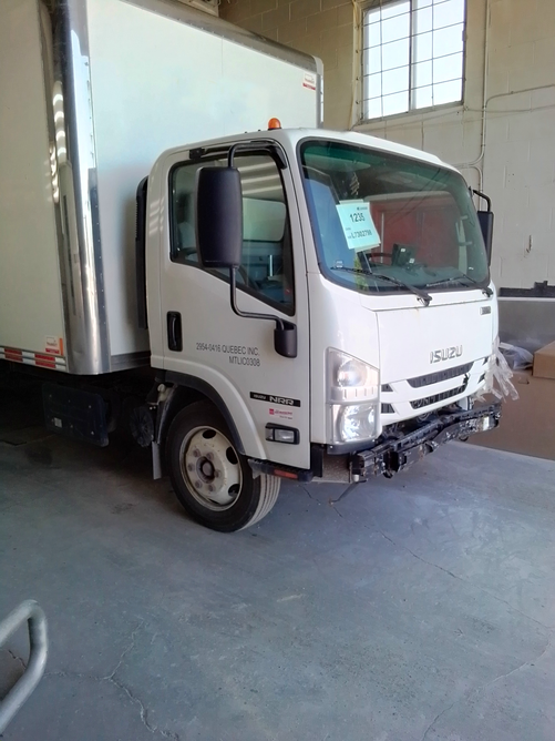 White truck to be repaired by J.B.Michor